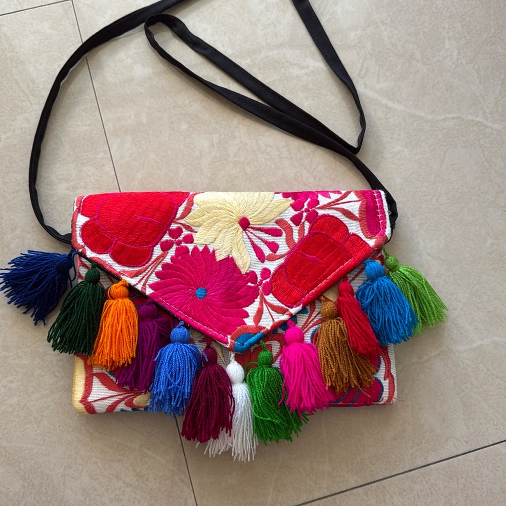 Floral embroidered tassel clutch